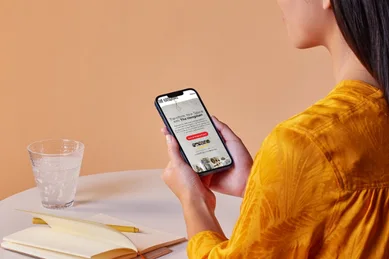 User viewing a mobile-optimized service business website on a smartphone, demonstrating responsive, mobile-first web design focused on usability and conversions.